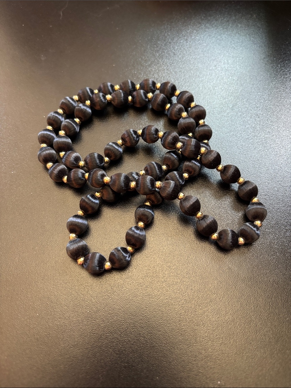 Handcrafted Black Silk Beaded Necklace with Gold Accents